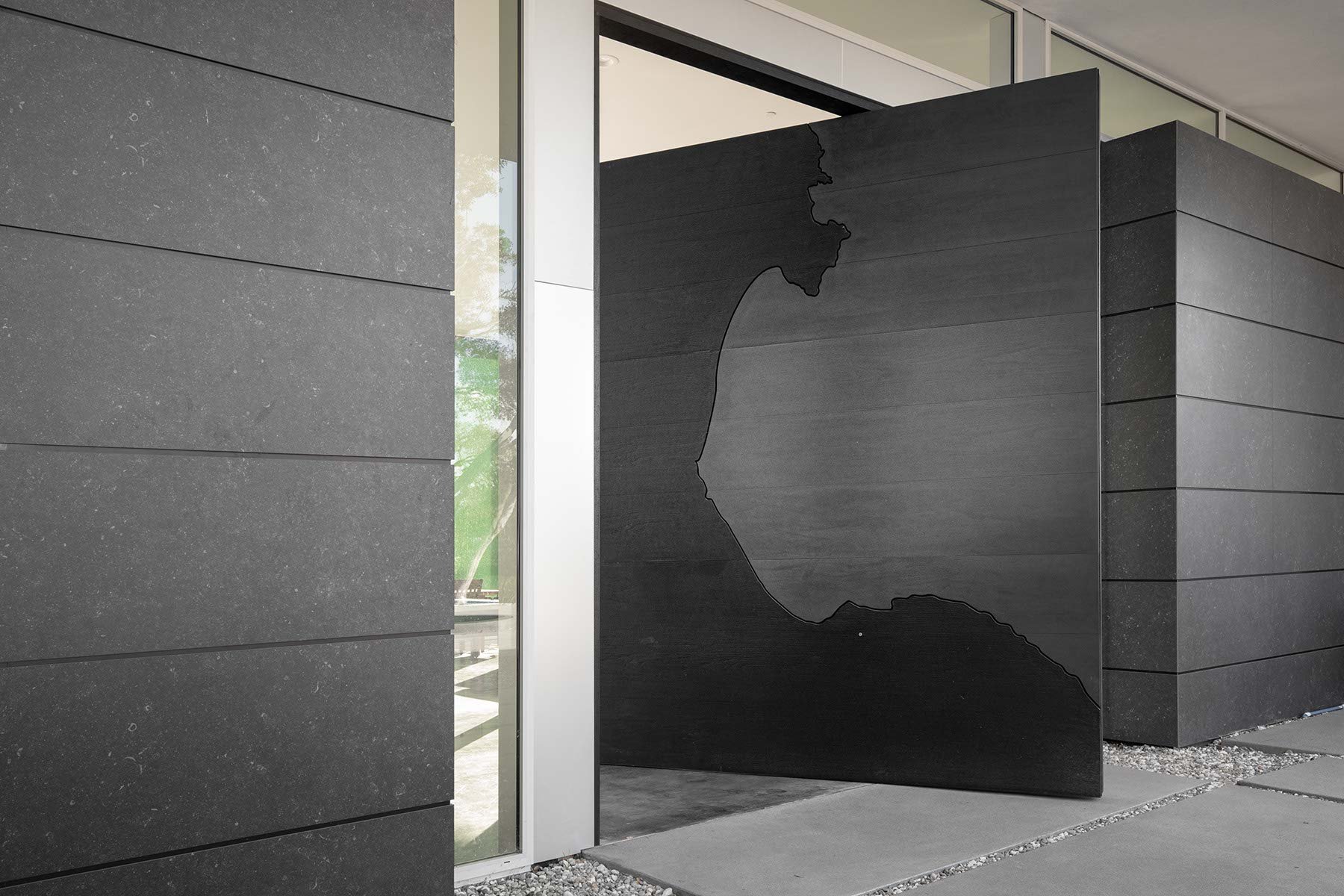 300 kg wooden door - Designed by Fuse Architects and Builders. Manufactured by Custom built by Architectural Millwork and Design. Photographed by Jesse Beer